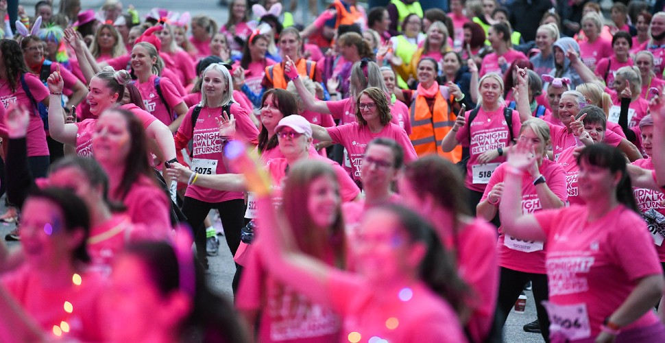 Crowds dressed in pink take part in Midnight Walk